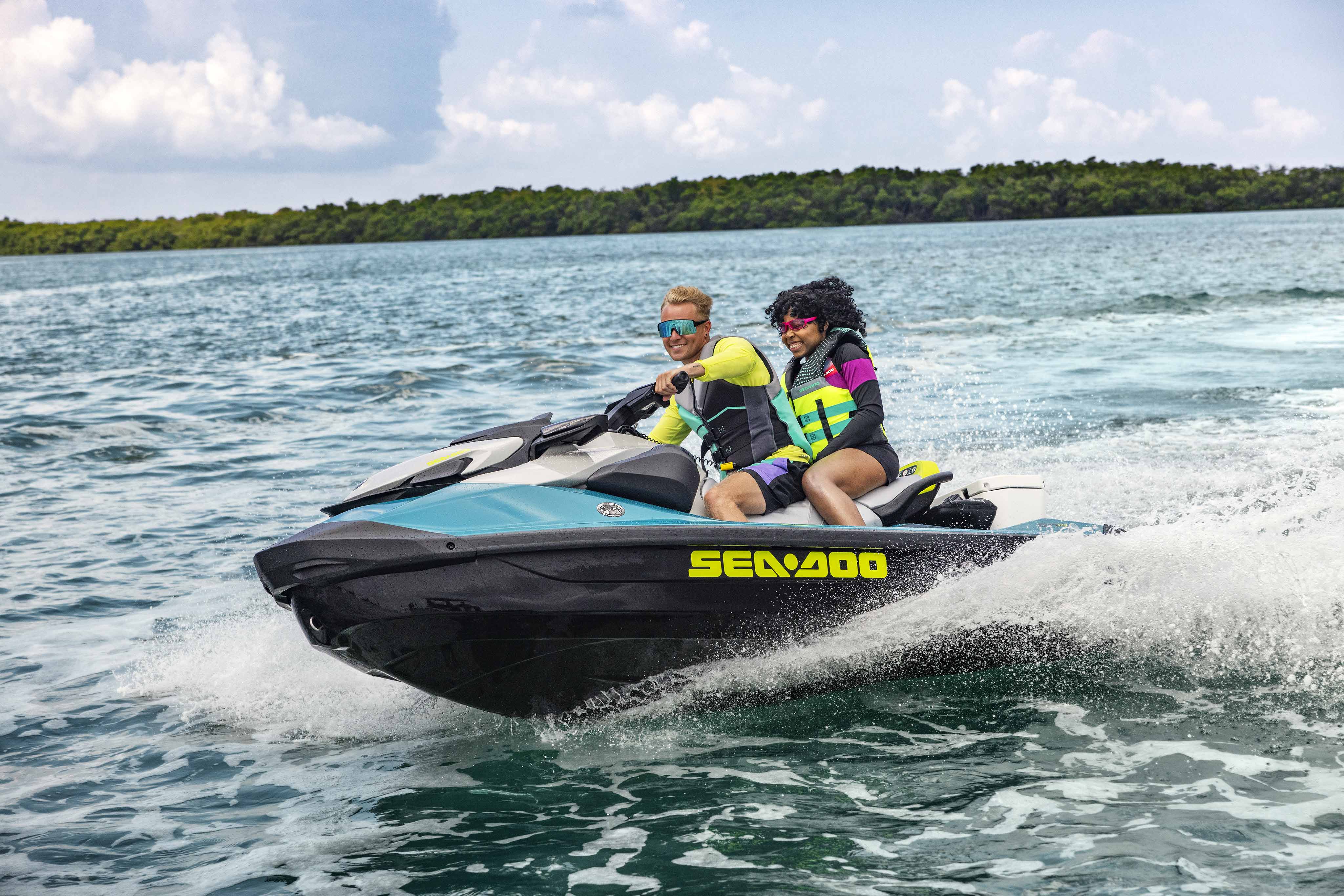 Couple riding a Sea-Doo GTI personal watercraft